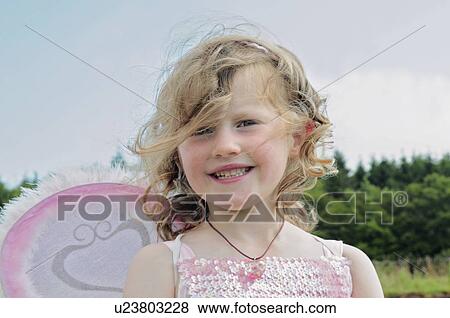 Stock Photo - Girl wearing fairy costume. Fotosearch