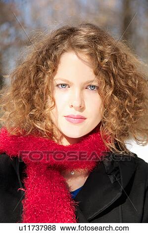 Stock Photo - Girl wearing fuzzy scarf outdoors. Fotosearch