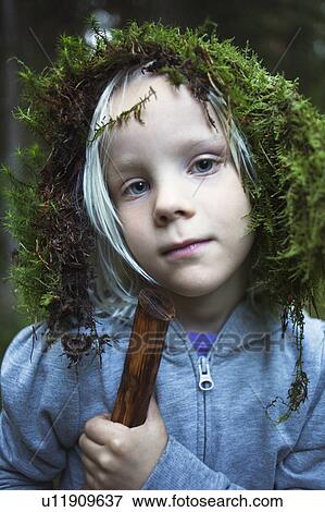 Girl wearing moss on her head outdoors View Large Photo Image Stock Photo - Girl wearing moss on her head outdoors. Fotosearch