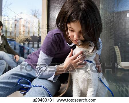 Girl with her cat in vet waiting room View Large Photo Image Stock Image - Girl with her cat in vet waiting room. Fotosearch