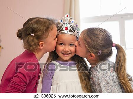 Girls kissing friend’s cheeks View Large Photo Image Stock Photography - Girls kissing friend’s cheeks. Fotosearch