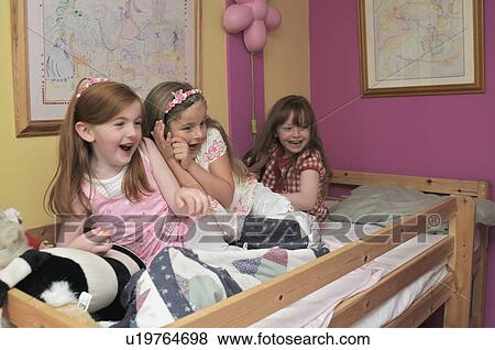 Girls playing in bedroom View Large Photo Image Stock Photo - Girls playing in bedroom. Fotosearch