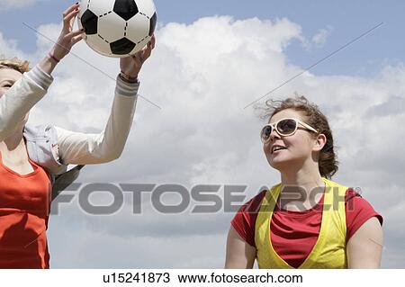 Girls playing soccer together View Large Photo Image Stock Image - Girls playing soccer together. Fotosearch