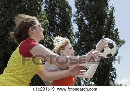 Girls playing soccer together View Large Photo Image Stock Photo - Girls playing soccer together. Fotosearch