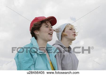 Stock Photography - Girls shouting outdoors. Fotosearch