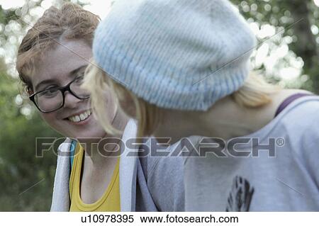Girls smiling together in park View Large Photo Image Stock Photography - Girls smiling together in park. Fotosearch