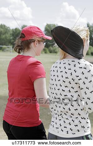 Girls walking in park together View Large Photo Image Stock Image - Girls walking in park together. Fotosearch