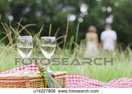 Stock Photo - Glasses of wine at picnic. Fotosearch
