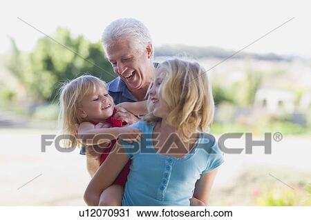 Grandfather playing with granddaughters View Large Photo Image Stock Image - Grandfather playing with granddaughters. Fotosearch