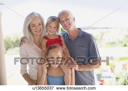 Grandparents and grandchildren smiling View Large Photo Image Stock Photo - Grandparents and grandchildren smiling. Fotosearch