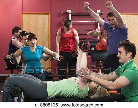 Group of people exercising in gym View Large Photo Image Stock Photography - Group of people exercising in gym. Fotosearch