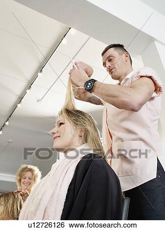 Hairdresser cutting woman’s hair View Large Photo Image Stock Photograph - Hairdresser cutting woman’s hair. Fotosearch