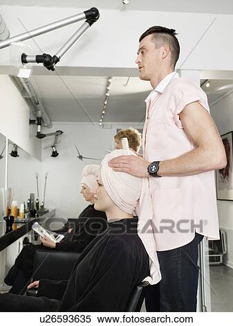 Hairdresser drying woman’s hair View Large Photo Image Stock Photography - Hairdresser drying woman’s hair. Fotosearch