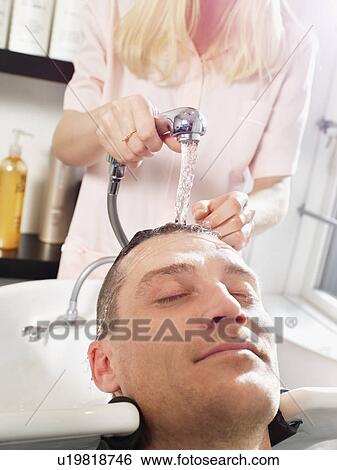 Hairdresser washing man’s hair View Large Photo Image Stock Photograph - Hairdresser washing man’s hair. Fotosearch