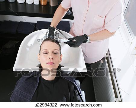 Hairdresser washing woman’s hair View Large Photo Image Stock Image - Hairdresser washing woman’s hair. Fotosearch