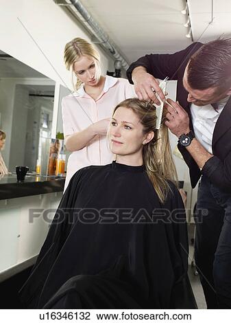 Hairdressers cutting woman’s hair View Large Photo Image Stock Image - Hairdressers cutting woman’s hair. Fotosearch