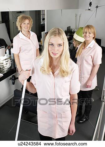 Picture - Hairdressers standing in salon. Fotosearch