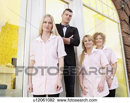 Hairdressers standing outside salon View Large Photo Image Stock Image - Hairdressers standing outside salon. Fotosearch