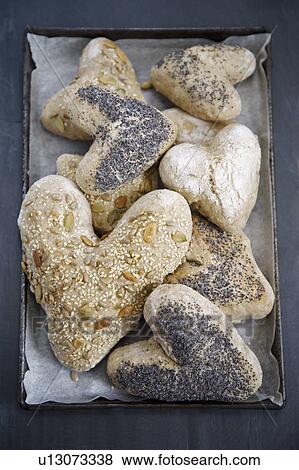 Heart shaped bread rolls on tray View Large Photo Image Stock Photo - Heart shaped bread rolls on tray. Fotosearch