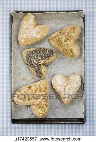 Heart shaped bread rolls on tray View Large Photo Image Stock Photo - Heart shaped bread rolls on tray. Fotosearch