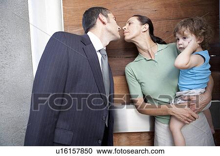 Husband kissing wife before work View Large Photo Image Stock Image - Husband kissing wife before work. Fotosearch