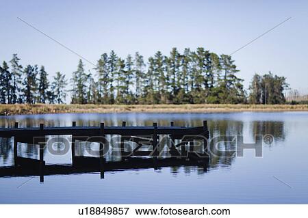 Jetty over rural lake View Large Photo Image Stock Photo - Jetty over rural lake. Fotosearch