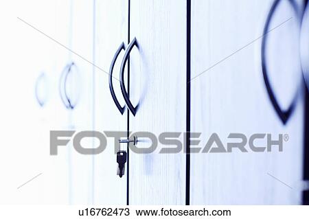 Stock Image - Keys in lock of office cabinet. Fotosearch