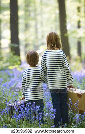 Kids with luggage in field of flowers View Large Photo Image Stock Image - Kids with luggage in field of flowers. Fotosearch