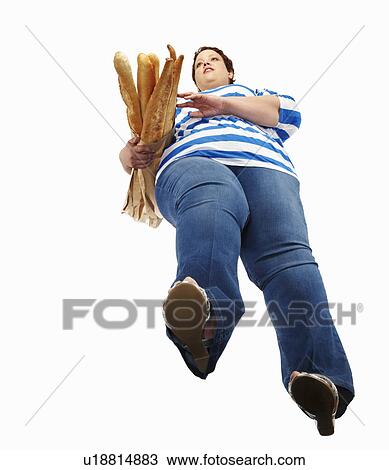 Large woman carrying baguettes View Large Photo Image Stock Image - Large woman carrying baguettes. Fotosearch
