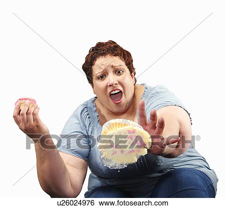 Large woman dropping cupcake View Large Photo Image Stock Photograph - Large woman dropping cupcake. Fotosearch