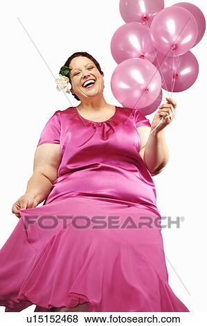 Large woman holding bunch of balloons View Large Photo Image Stock Photo - Large woman holding bunch of balloons. Fotosearch