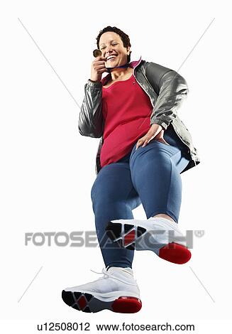 Stock Image - Large woman holding medal. Fotosearch