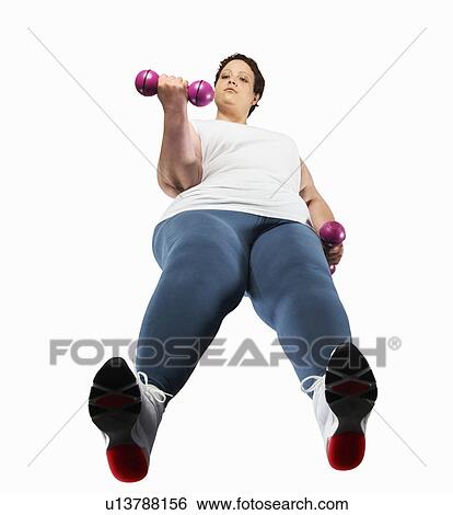 Large woman lifting weights View Large Photo Image Stock Photograph - Large woman lifting weights. Fotosearch