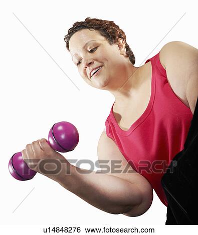 Stock Photograph - Large woman lifting weights. Fotosearch