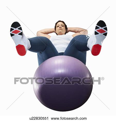 Large woman using exercise ball View Large Photo Image Stock Image - Large woman using exercise ball. Fotosearch