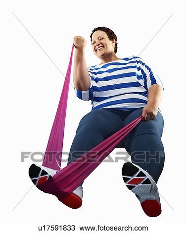 Large woman using resistance band View Large Photo Image Stock Image - Large woman using resistance band. Fotosearch