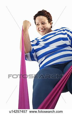 Large woman using resistance band View Large Photo Image Stock Photo - Large woman using resistance band. Fotosearch
