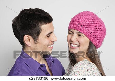 Laughing couple hugging View Large Photo Image Stock Photograph - Laughing couple hugging. Fotosearch
