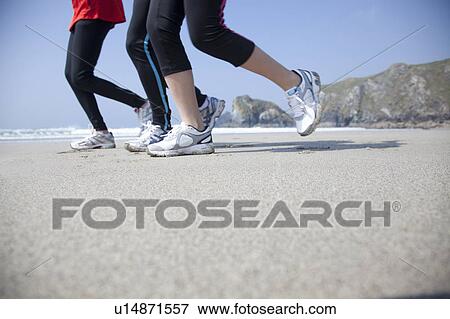 Legs running on beach View Large Photo Image Stock Photo - Legs running on beach. Fotosearch