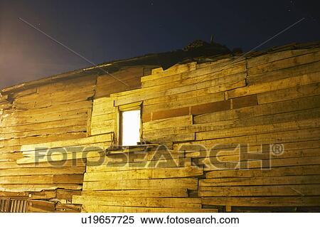 Lit window of wooden building View Large Photo Image Stock Photography - Lit window of wooden building. Fotosearch