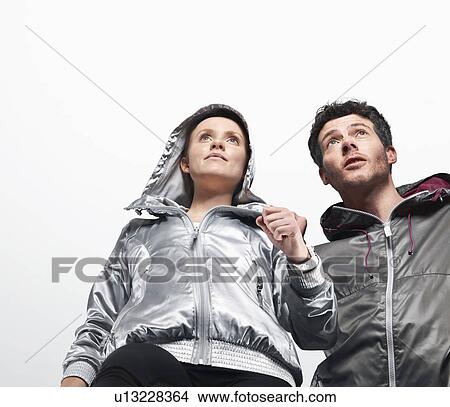 Low angle view of couple jogging View Large Photo Image Picture - Low angle view of couple jogging. Fotosearch
