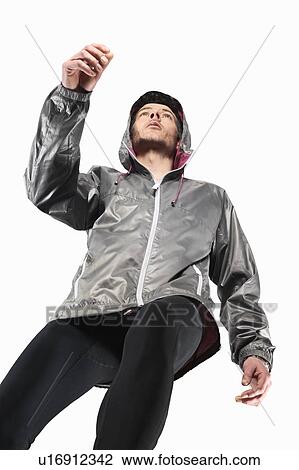 Stock Image - Low angle view of man jogging. Fotosearch
