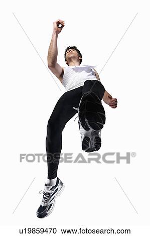 Low angle view of man jogging View Large Photo Image Stock Image - Low angle view of man jogging. Fotosearch