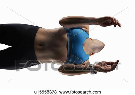 Low angle view of woman exercising View Large Photo Image Stock Photo - Low angle view of woman exercising. Fotosearch
