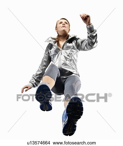 Picture - Low angle view of woman jogging. Fotosearch