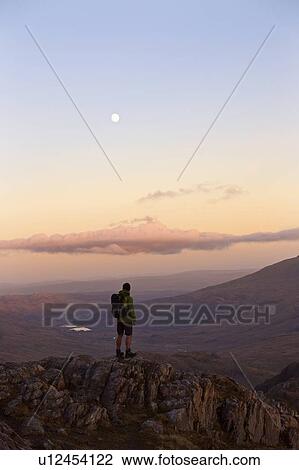 Man admiring mountain view View Large Photo Image Stock Image - Man admiring mountain view. Fotosearch