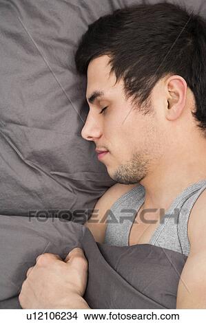 Man asleep in bed View Large Photo Image Picture - Man asleep in bed. Fotosearch