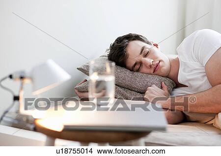 Man asleep in bed View Large Photo Image Picture - Man asleep in bed. Fotosearch