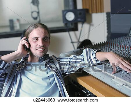 Man at control panel in recording studio View Large Photo Image Stock Image - Man at control panel in recording studio. Fotosearch