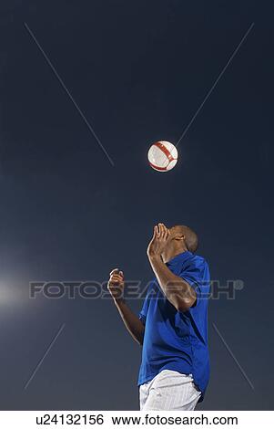 Man bouncing soccer ball on his head View Large Photo Image Stock Photograph - Man bouncing soccer ball on his head. Fotosearch